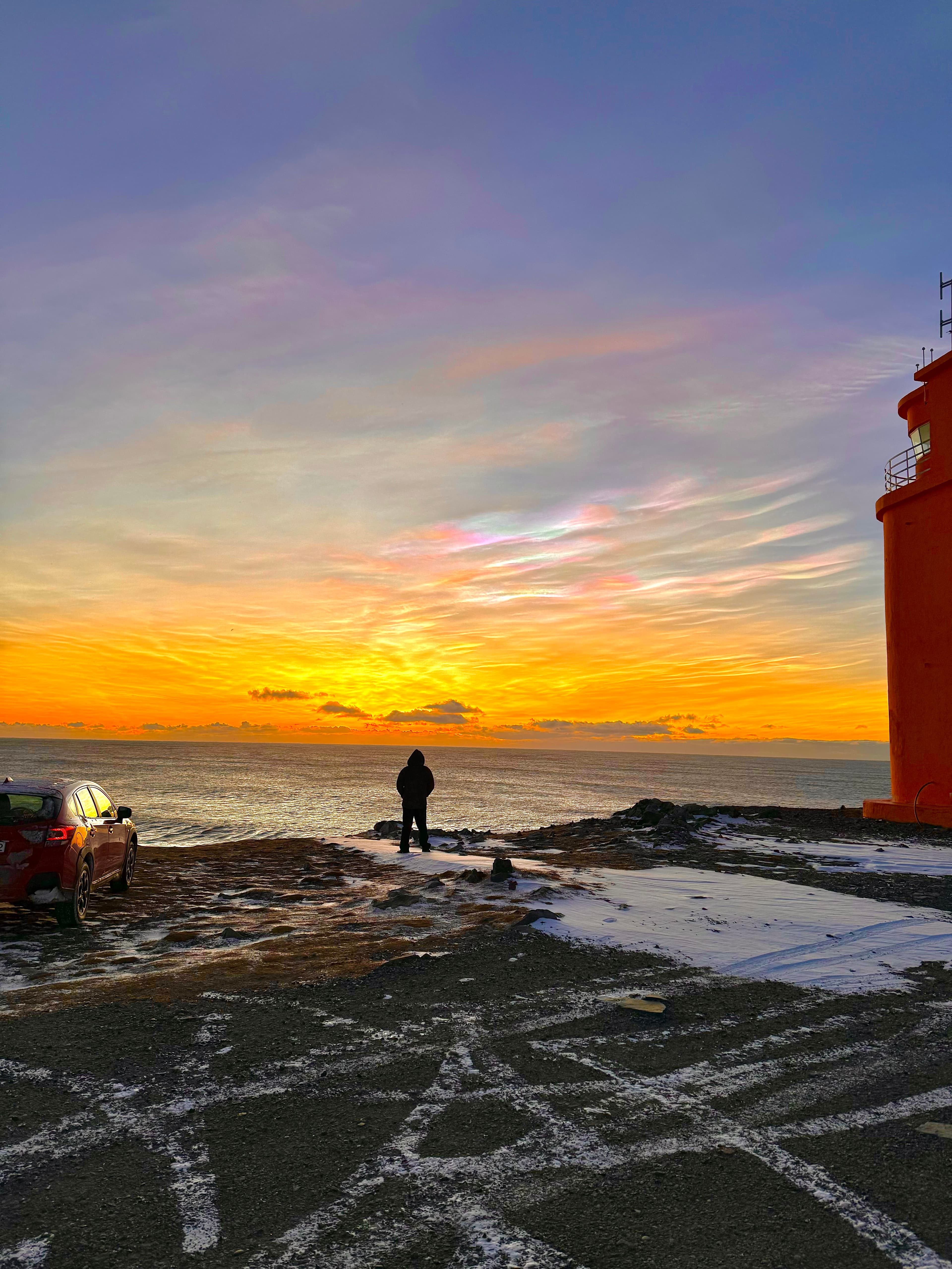 A lone figure watching the sunset — clarity comes from stillness