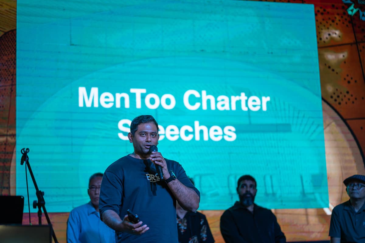 Prathap at the MenToo Charter signing event, speaking on men's wellbeing