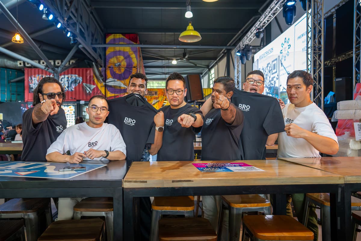 A team of men grinning together after a Men-Kind session